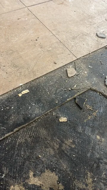 Black bitumen mastic floor removal in a SW6 flat